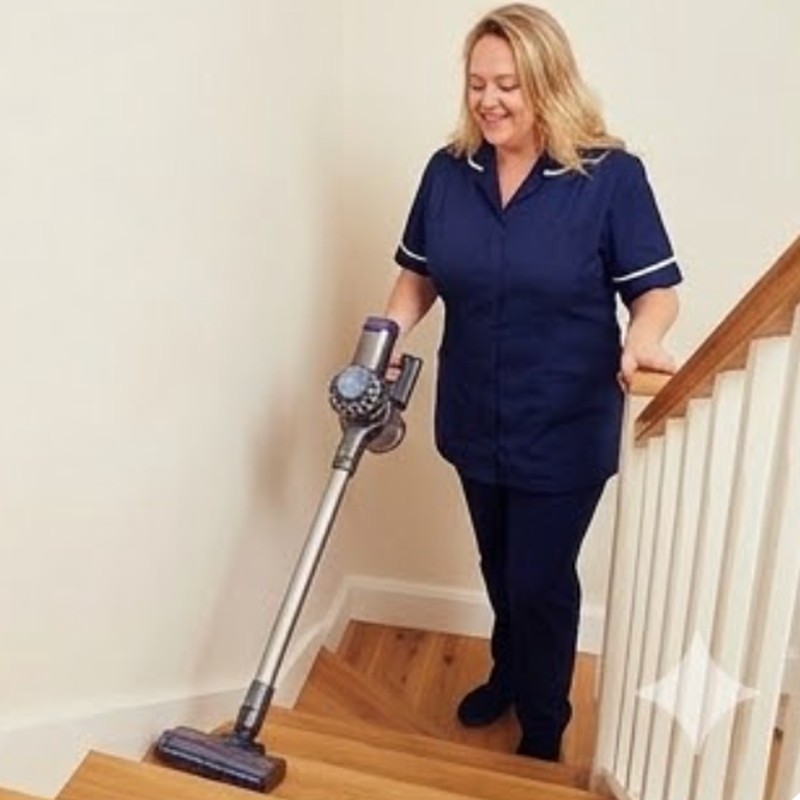Sarah hoovering the stairs